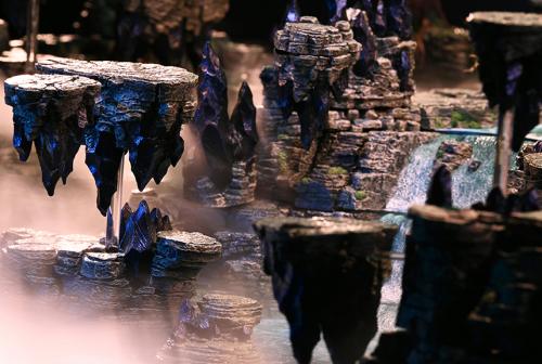 Mountain driftstones float around the waterfalls.